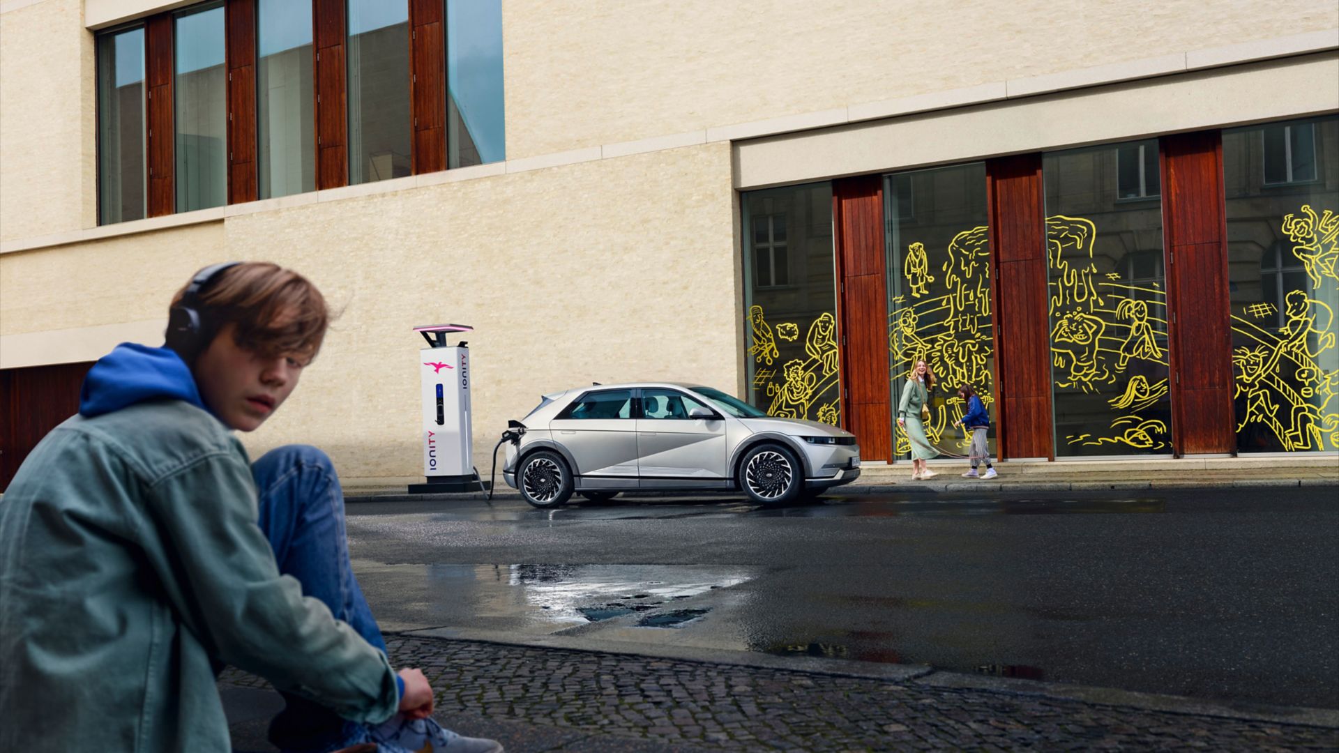 The Hyundai IONIQ 5 electric vehicle getting charged at an IONITY charging station.