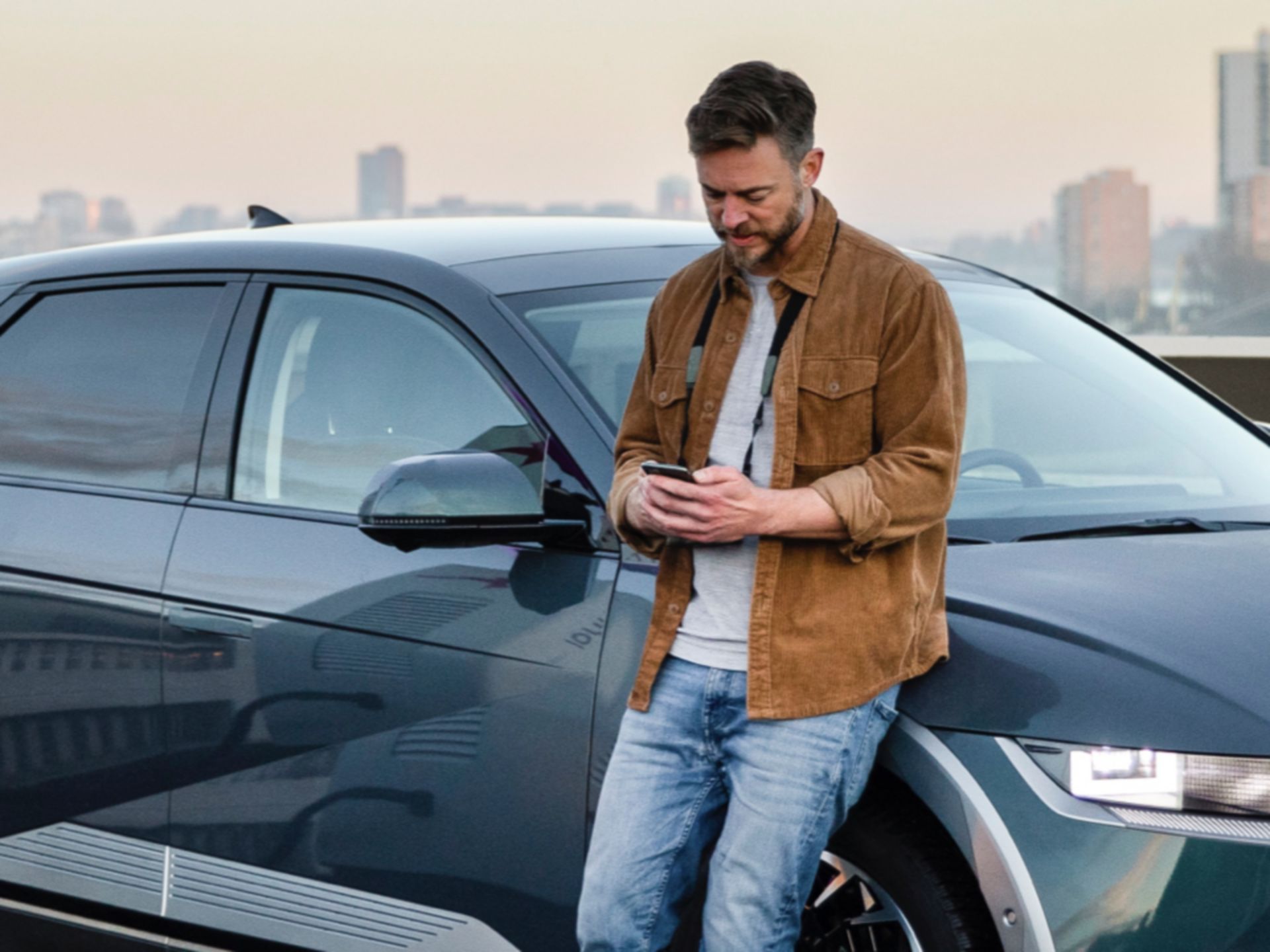 A Hyundai IONIQ 5 driver charging his EV at an IONITY station with his Lite package.	