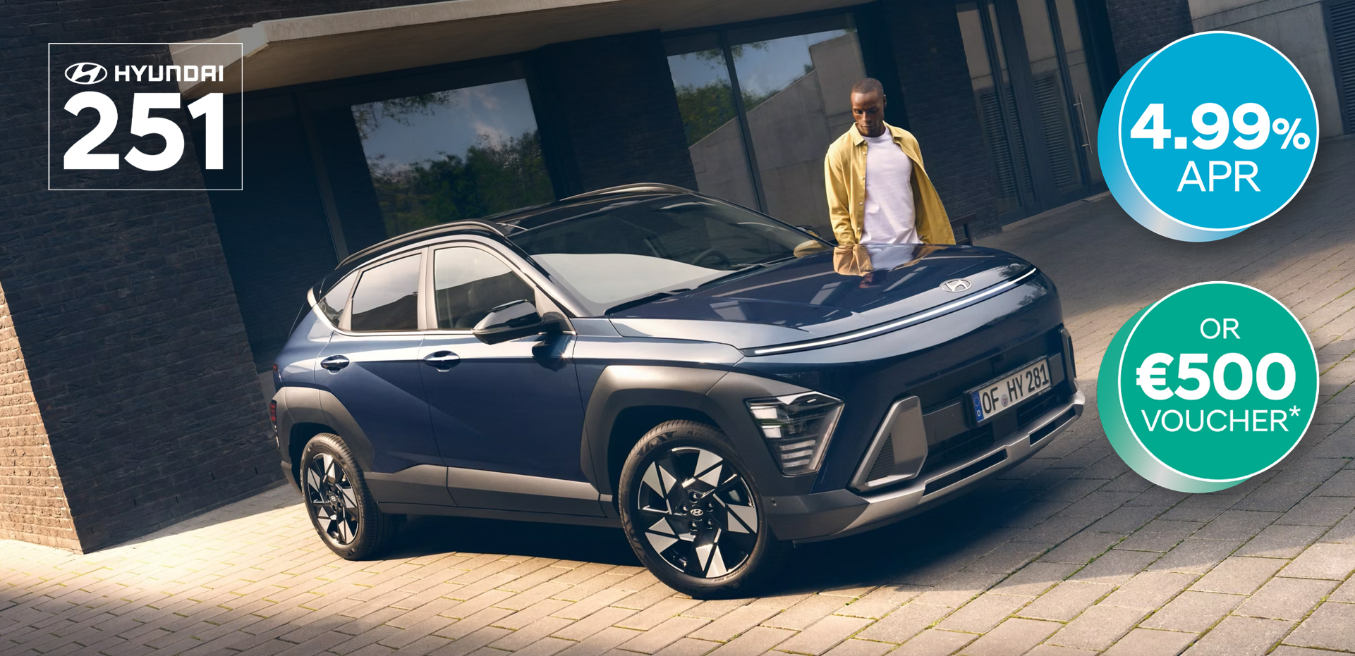 The all-new Hyundai KONA in blue parked next to a men with yellow shirt.