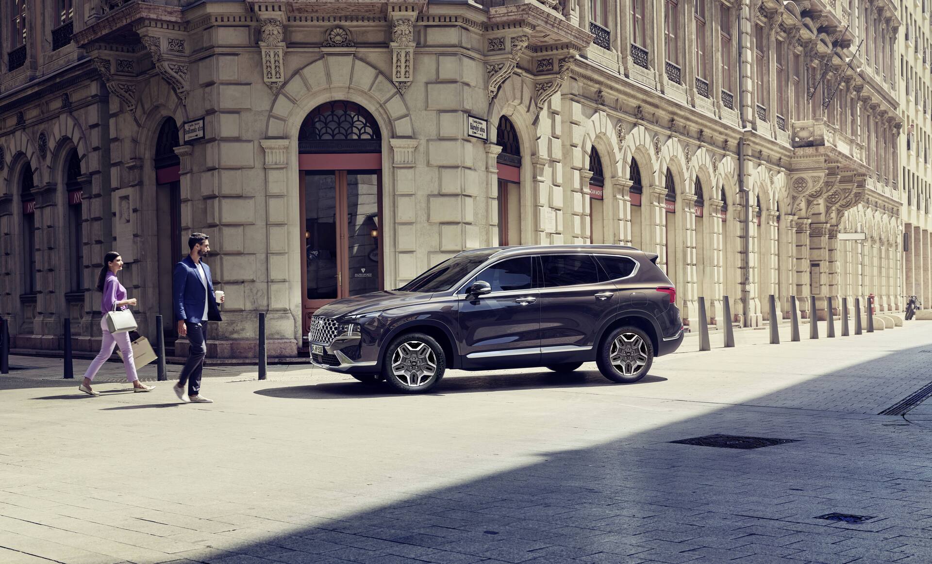 Hyundai Santa Fe Plug-in Hybrid 7 seat SUV parked on a city street.