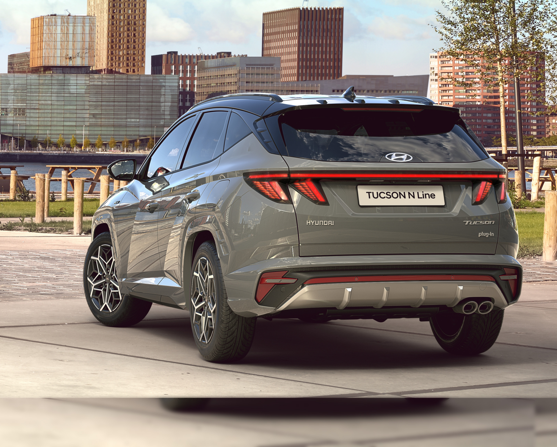 Hyundai TUCSON Plug-in Hybrid N Line from the rear at the river side in a city.